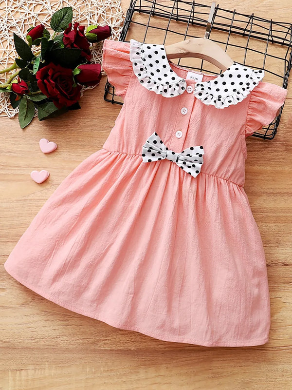 Robe fille col Claudine avec nœud et manches à volants - vue de face - style vintage élégant - BabyCoton Suisse