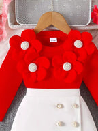 💫 L'ensemble qui fait fleurir les sourires :

🌺 Haut côtelé doux avec adorables appliqués floraux en relief 🎀 Volants délicats qui ajoutent une touche romantique 👗 Jupe élégante ornée de jolis boutons décoratifs 🌼 Design champêtre-chic qui respire la douceur ✨ Elle se sent comme une princesse de jardin secret
