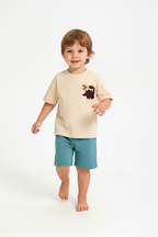 Enfant en ensemble dinosaure beige et bleu - pose en marche - tenue décontractée enfant - BabyCoton
