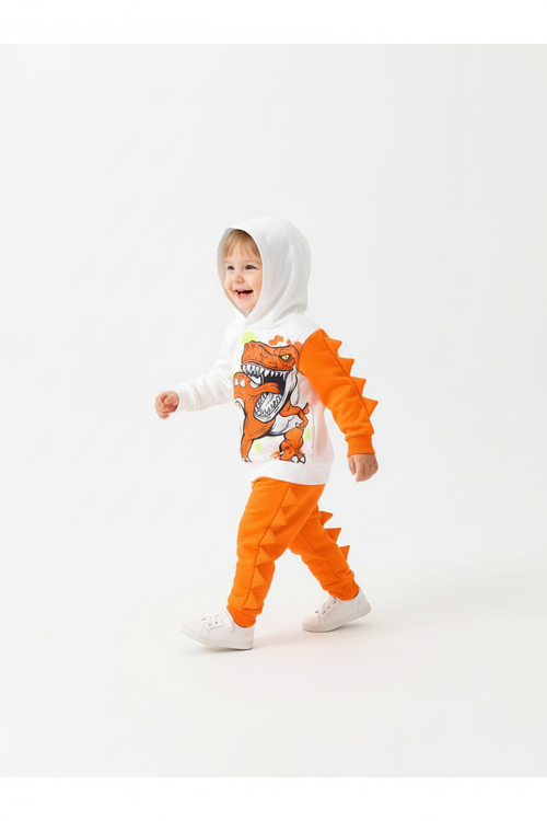   Enfant marchant avec capuche relevée en ensemble dinosaure blanc et orange avec picots 3D »