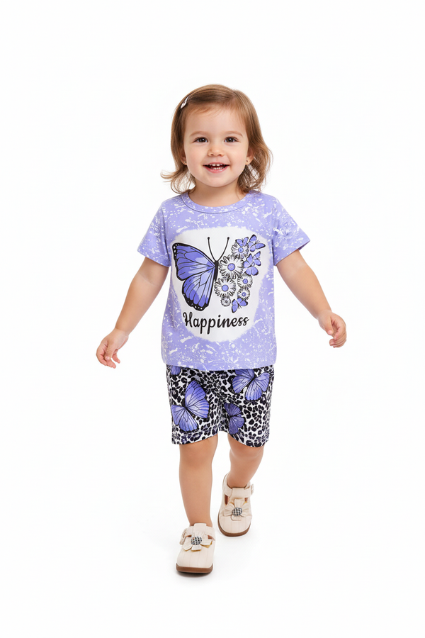 Fille en ensemble Happiness lilas - t-shirt tie-dye lilas papillon bleu marguerites et short léopard papillons violets - pose en marche - BabyCoton